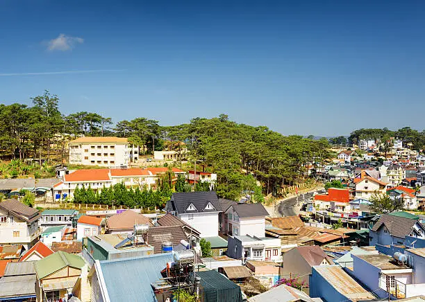 Beautiful view of Da Lat city (Dalat) on the blue sky background in Vietnam. Da Lat and the surrounding area is a popular tourist destination of Asia.