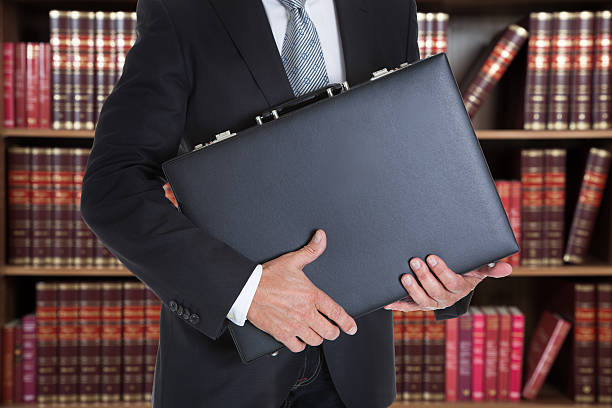 istock Businessman Holding Briefcase In Office 590621598