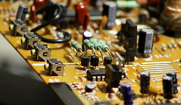 istock Printed electronic board with soldered radio components macro shot 590622038