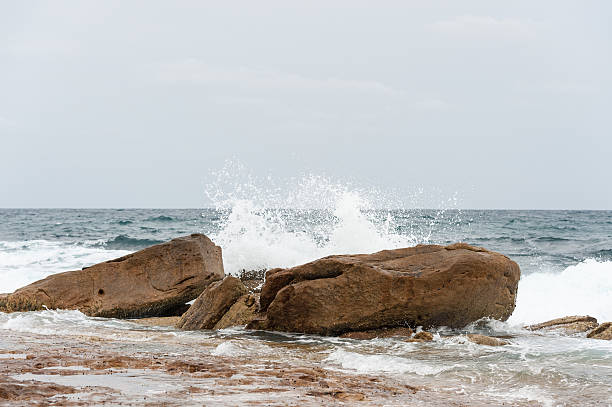 istock Ocean Waves and Rock in Water, Sydney, Australia. 590623120