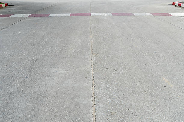 istock Concrete road with red and white sign 590623214