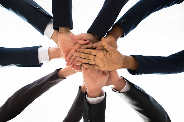 istock Businesspeople Stacking Together Over Each Other 590623736
