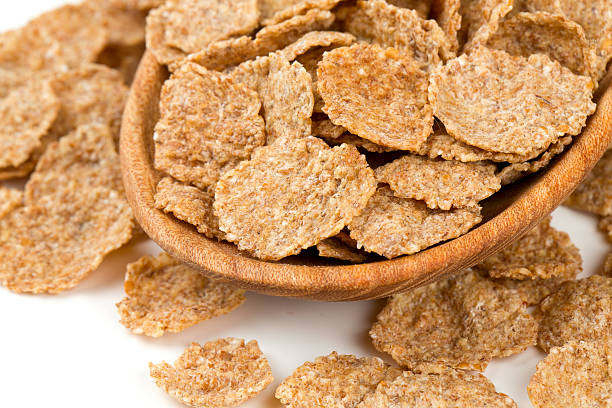 istock pile of bran flakes isolated on white 590624246