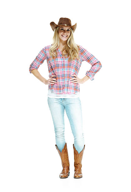 istock Cheerful cowgirl standing 590624996