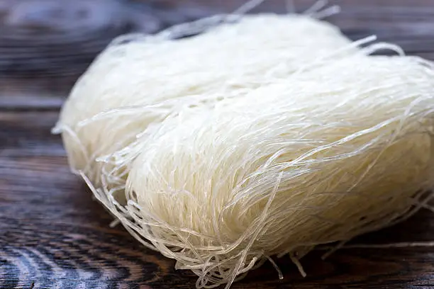 Thai Dried Rice Noodles on wooden background