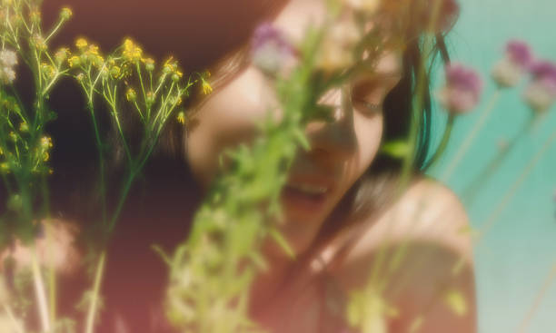 istock girl's face with flowers 590625866