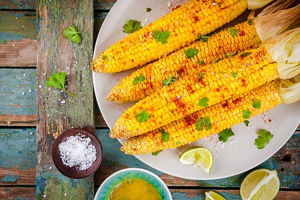 istock baked sweet corn cobs with herb butter and lime 590627312
