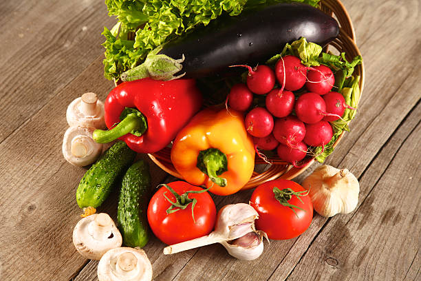 istock Fresh vegetables on a clean wooden table 590628054