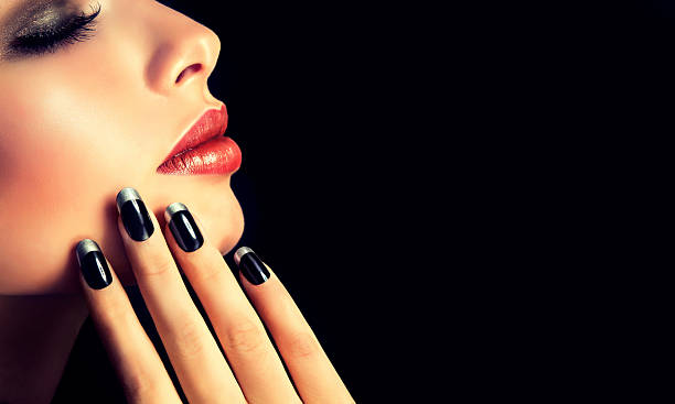French-style manicure on nails and red lipstick. stock photo