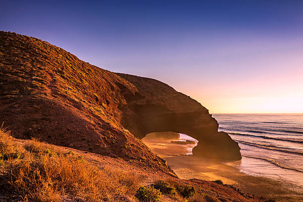 istock Red arches of Legzira beach 591400662