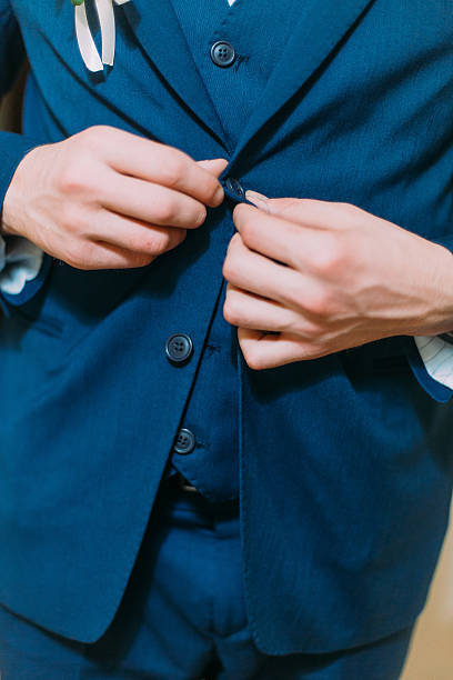 istock Elegant young man dressing blue jacket as part of his 591401866