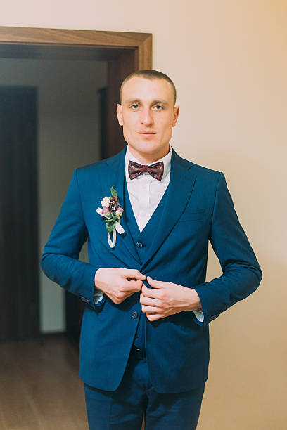 istock Handsome young short hair athletic man dressed in blue suit 591401934