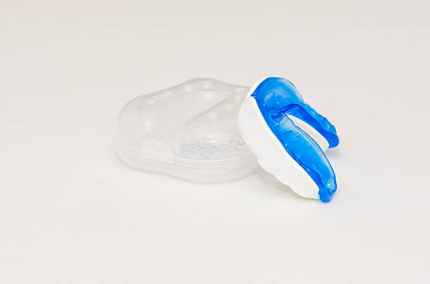 istock blue molded sports gum mouth guard on white background 591402632