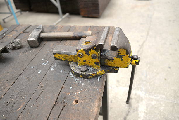 istock hummer and clamp on old natural wood 591403728