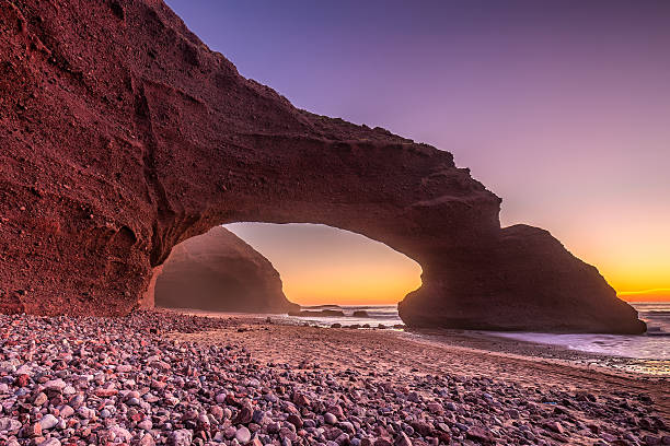 istock Red arches of Legzira beach 591404152