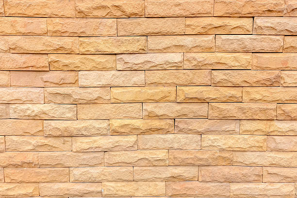 istock stone orange brick stick in the wall as a background 591404466