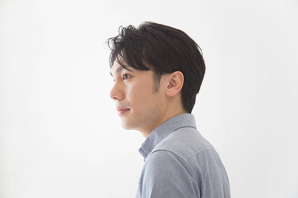 Japanese man looking away from camera
