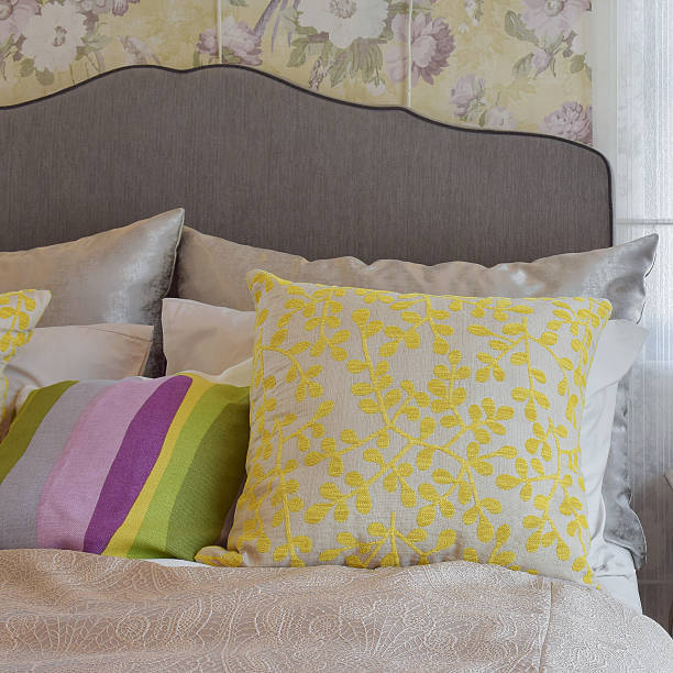 istock cozy bedroom interior with colorful pillow on bed 591405506