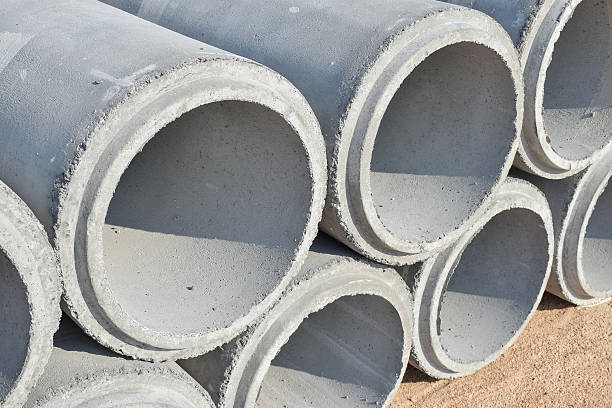 Cement pipes stacking at yard stock photo