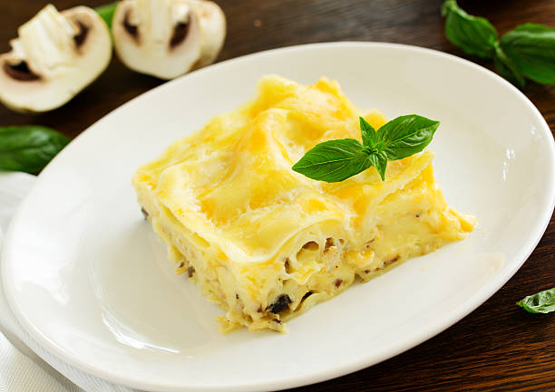 istock piece of lasagna with chicken and mushrooms. 591410654