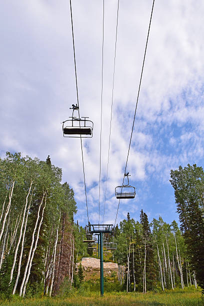 Ski Lift in Summer A ski lift and ski slope in Utah during the summertime. deer valley resort stock pictures, royalty-free photos & images