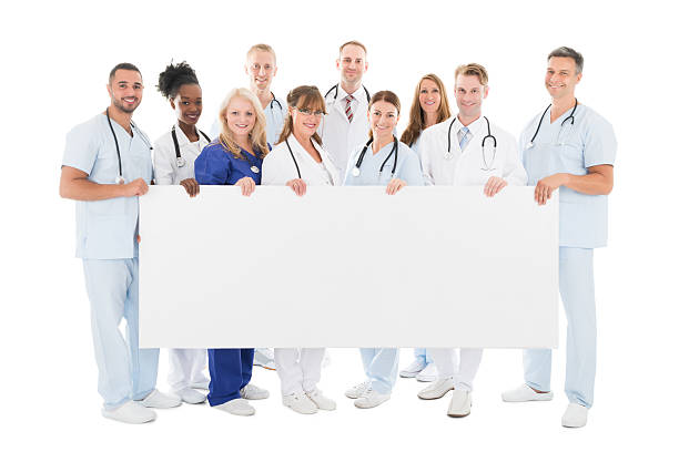 istock Confident Multiethnic Medical Team Holding Blank Billboard 591412726