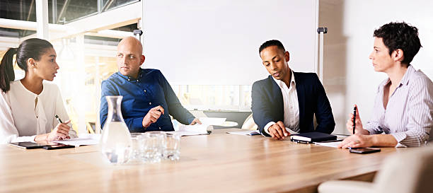 istock Four business executives collaberating on a new project together 591413288