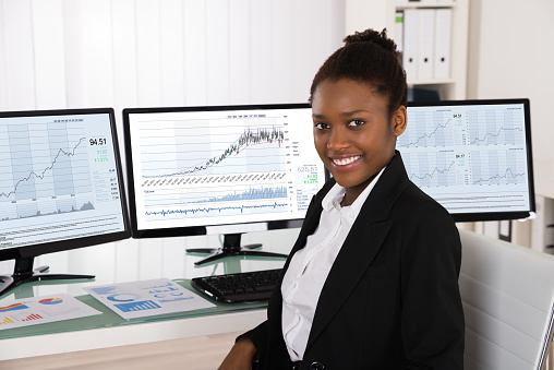 Photo Of Young African Stock Broker In Office