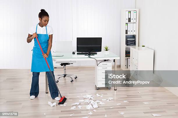 Closeup Of Janitor Sweeping Hardwood Floor Stock Photo - Download