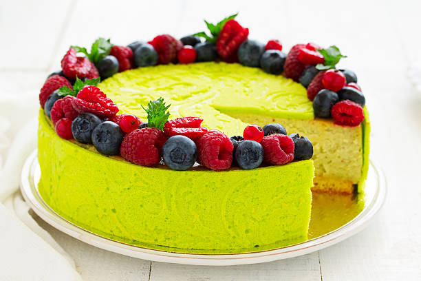 istock Home pistachio cheesecake with raspberries and blueberries. 591413820