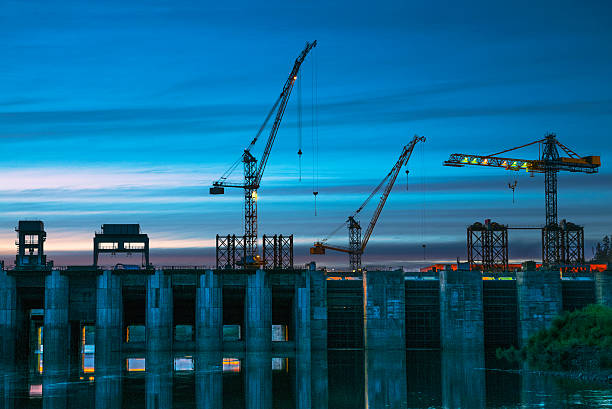 The dam, evening, construction cranes stock photo