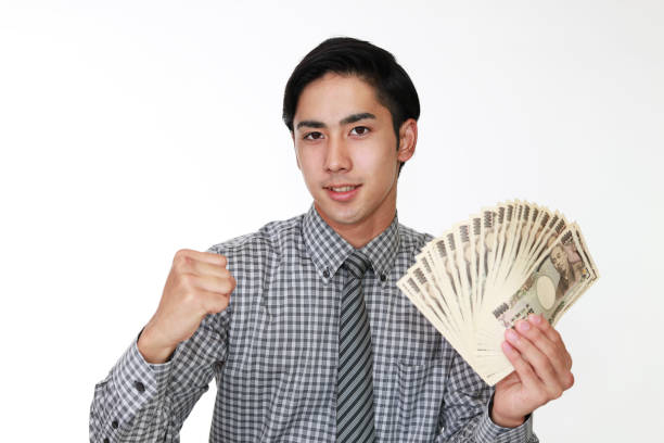 istock The male office worker who poses happily 591414554
