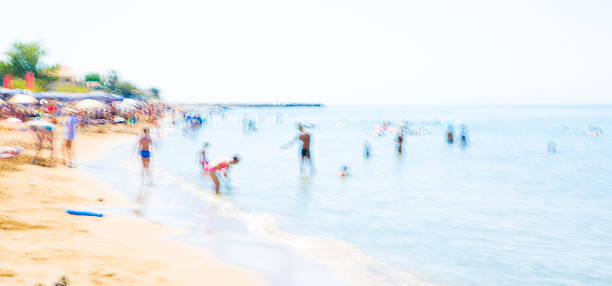 istock People playing in sea, Blurred image.  Greece 591416986
