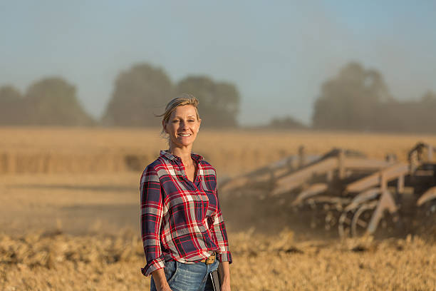 istock female farmer with tractor 591417068