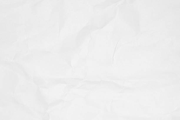 istock Crumpled white paper texture or paper background. 591417310