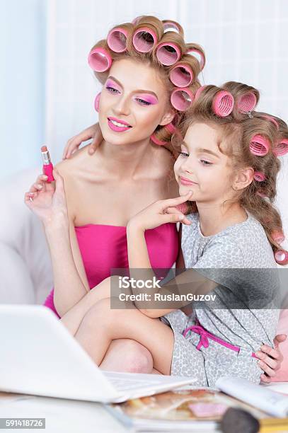 Mother And Daughter With Laptop Stock Photo - Download Image Now - Adult, Arts Culture and Entertainment, Beautiful People