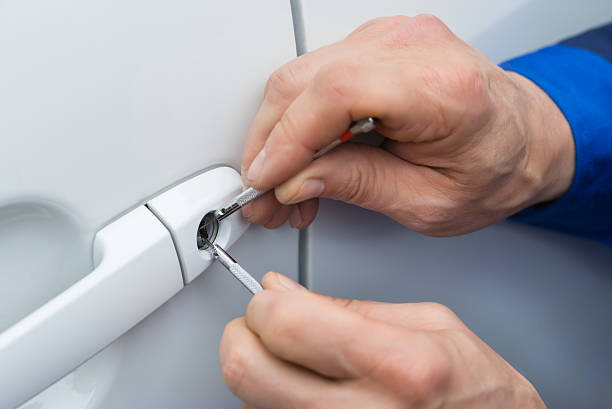 istock Hand Holding Lockpicker To Open Car Door 591419188