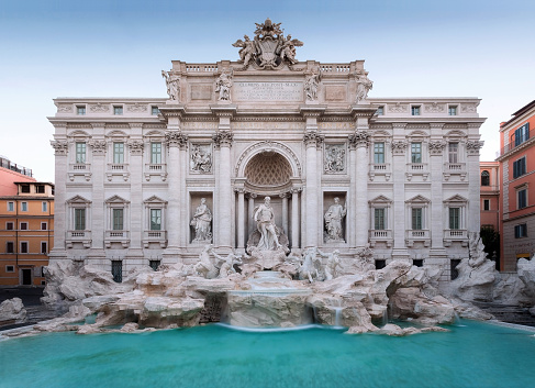 The famous Trevi fountain seen from the front. daylight photography with natural light, long exposure to highlight the movement of the water falls.