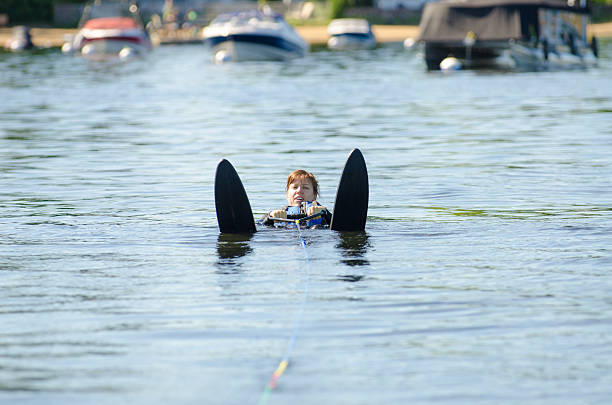 istock Woman in water ready to start water skiing 591420918