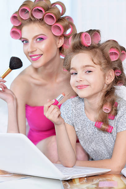 istock Mother and daughter  with laptop 591421038