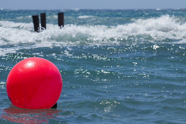 istock seascape with red ball on the waves 591421258