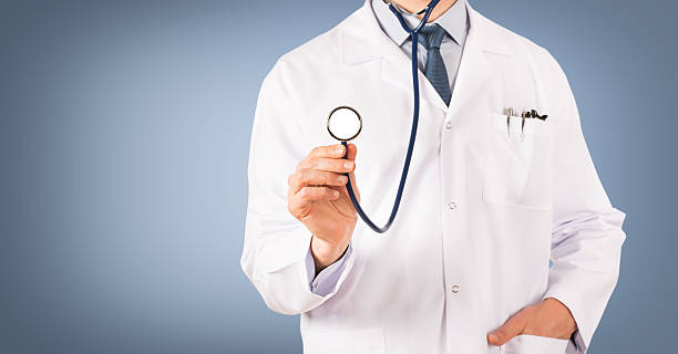 istock Doctor in front of a blue background 591421306