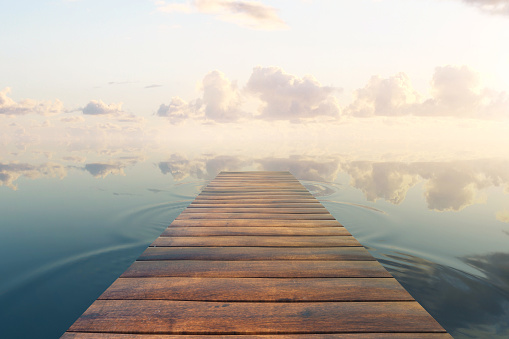 Wooden plank sea pier on beautiful sky background. 3D Rendering