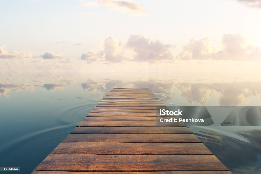 Pier on sky background Wooden plank sea pier on beautiful sky background. 3D Rendering Pier Stock Photo