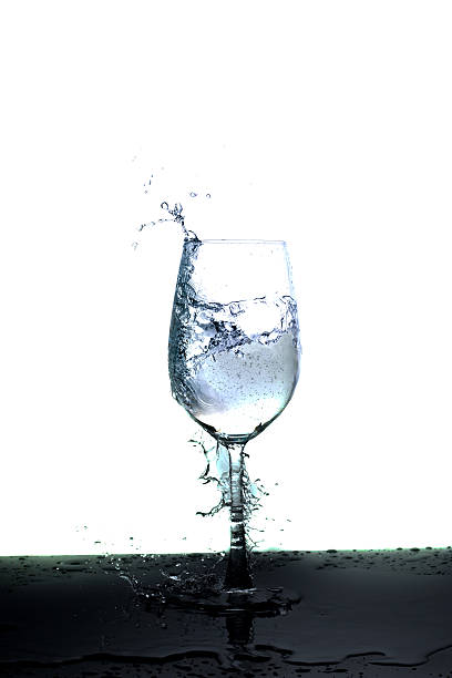 istock water splash in glass isolated on white 591421394