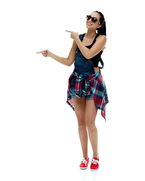 istock Cheerful female pointing away 591421842