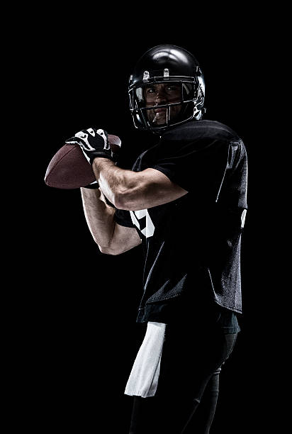 American football player playing American football player playinghttp://www.twodozendesign.info/i/1.png american football player studio stock pictures, royalty-free photos & images