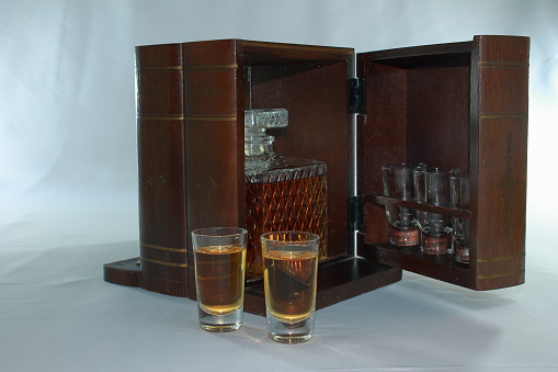 Vintage wood mini bar with shot glasses