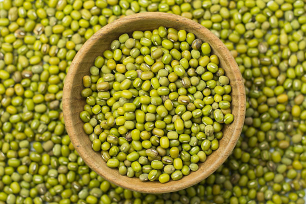 istock Mung beans in wood bowl background 591428018