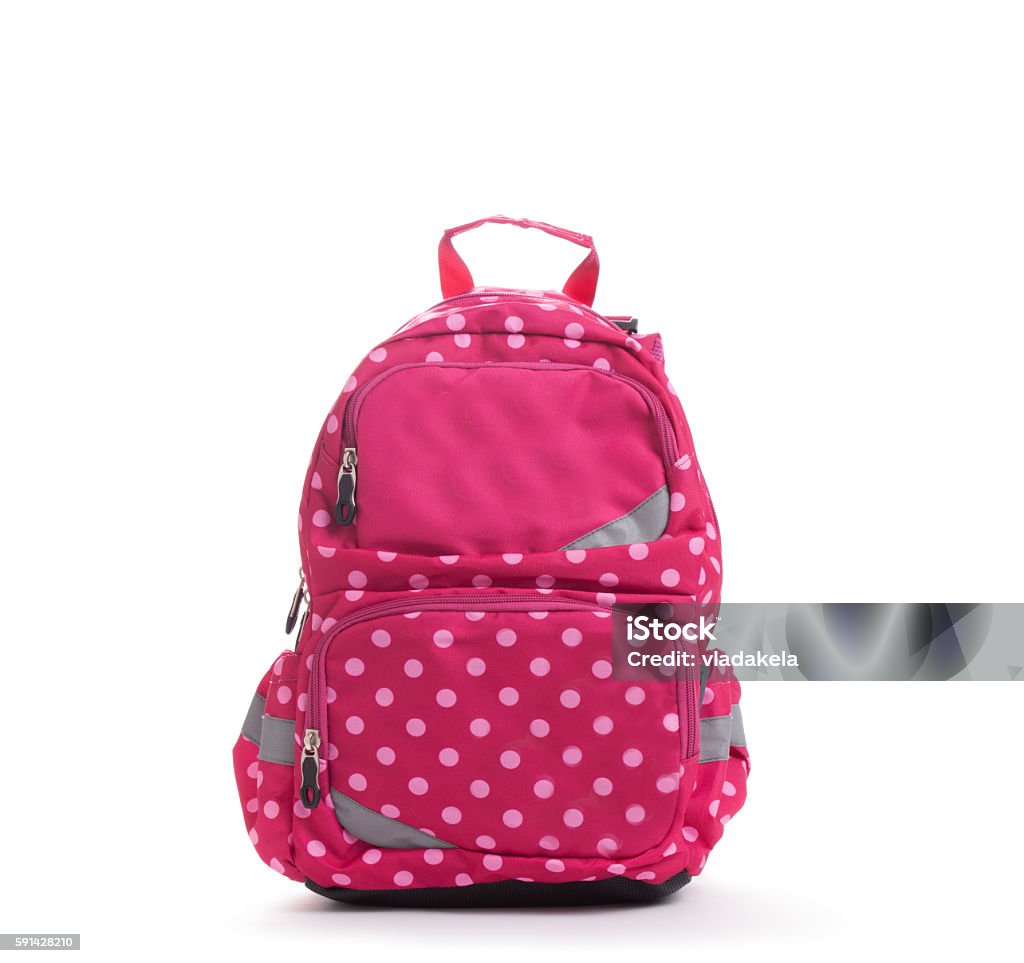 Pink school backpack with white dots isolated on white Pink school backpack with white dots isolated on white. Backpack Stock Photo